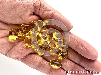 Handful of fish oil capsules Stock Photo